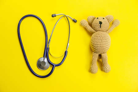 medical supplies on a yellow background, pills water treatment mask virus. Selective focusの写真素材