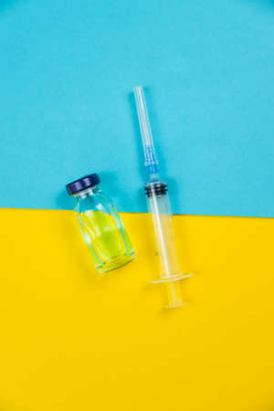 medical supplies on a yellow background, pills water treatment mask virus. Selective focusの写真素材