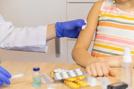 Injection vaccine against virus, injecting child.の写真素材