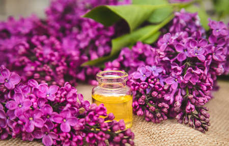 Lilac essential oil in a small bottle. Selective focus. Nature.の写真素材