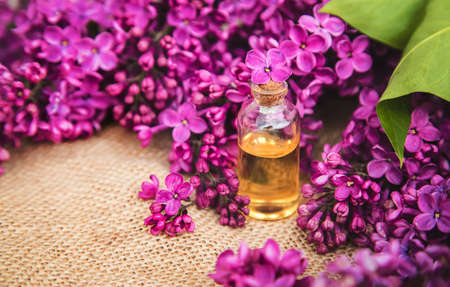 Lilac essential oil in a small bottle. Selective focus. Nature.の写真素材