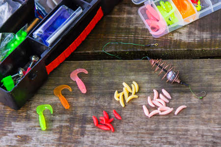 many colorful lures for fishing on the wooden pier. Selective focus. natureの写真素材