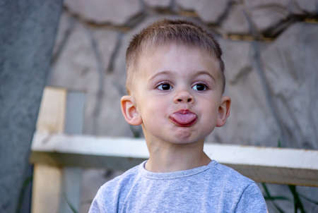child eats ice cream in nature, ice cream in a cup. Nature. Selective focusの写真素材