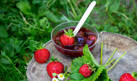 Strawberry jelly, jam on a wooden background, environmentally friendly product. Selective focusの写真素材