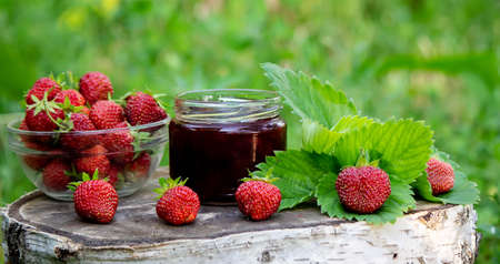 Strawberry jelly, jam on a wooden background, environmentally friendly product. Selective focusの写真素材