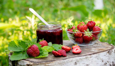 Strawberry jelly, jam on a wooden background, environmentally friendly product. Selective focusの写真素材