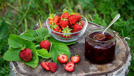 Strawberry jelly, jam on a wooden background, environmentally friendly product. Selective focusの写真素材