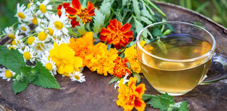 Chamomile tea on a wooden background. Nature. Selective focusの写真素材