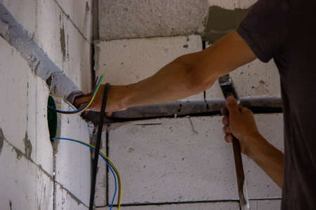 electrical wiring of the house, cable on the wall in the gate. Selective focusの写真素材