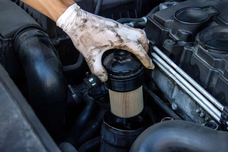 replacing the oil filter on the car. Selective focusの写真素材