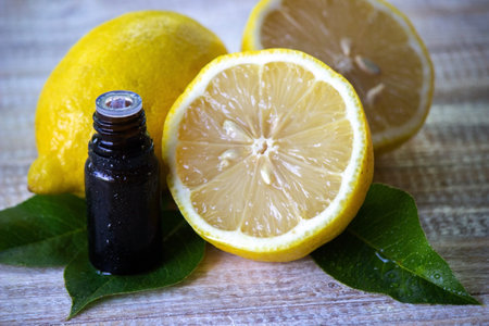 A bottle of lemon essential oil is an alternative medicine. Selective focus