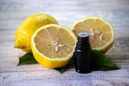 A bottle of lemon essential oil is an alternative medicine. Selective focusの写真素材