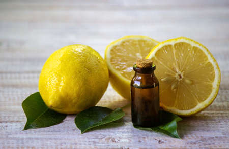 A bottle of lemon essential oil is an alternative medicine. Selective focusの写真素材
