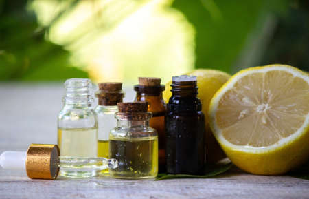A bottle of lemon essential oil is an alternative medicine. Selective focusの写真素材