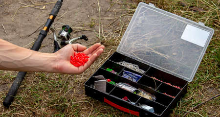fishing tackle on a wooden float with mountain background and selective focus, natureの写真素材