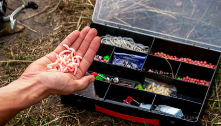 fishing tackle on a wooden float with mountain background and selective focus, natureの写真素材