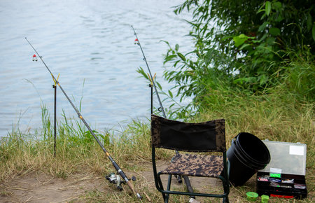 Fishing tackle on the river bank, bait rod, spinning rod, fish. Nature. Selective focusの写真素材