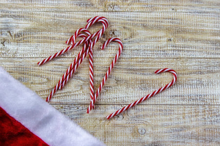 Christmas, rosette on a wooden background of New Year's toys gifts. Selective focus.
