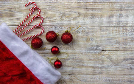 Christmas, rosette on a wooden background of New Year's toys gifts. Selective focus.の写真素材