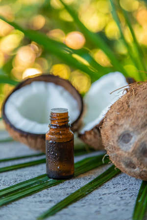 Coconut fruits and coconut oil isolated on table background. selective focusの写真素材