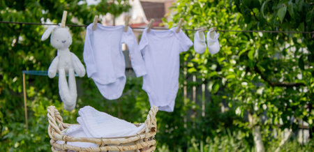 washing baby clothes. Linen dries in the fresh air. selective focus. nature.の写真素材