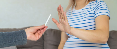 The pregnant woman refuses to smoke. selective focus. home.の写真素材