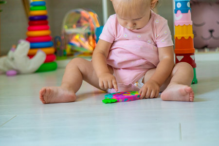 little girl is playing with toys. Selective focus.の写真素材