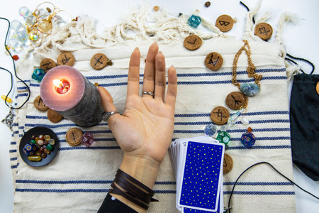 A fortune teller reads with tarot cards. Selective focus. Woman.の写真素材