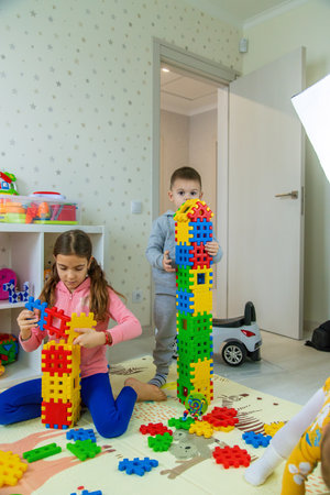 Children playing with toys in the room. Selective focus.の写真素材