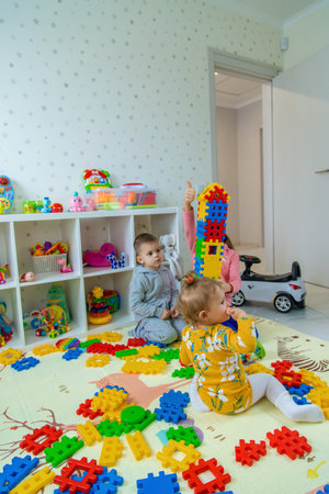 Children playing with toys in the room. Selective focus.の写真素材
