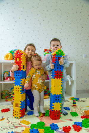 Children playing with toys in the room. Selective focus.の写真素材