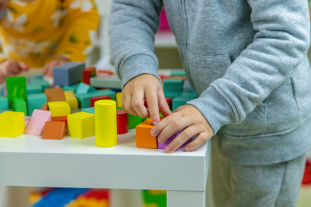 Children playing with toys in the room. Selective focus.の写真素材