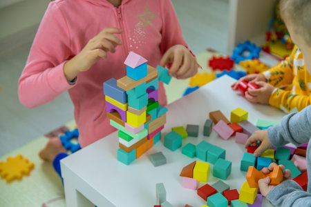 Children playing with toys in the room. Selective focus.の写真素材