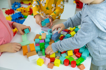 Children playing with toys in the room. Selective focus.の写真素材