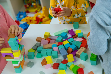 Children playing with toys in the room. Selective focus.の写真素材
