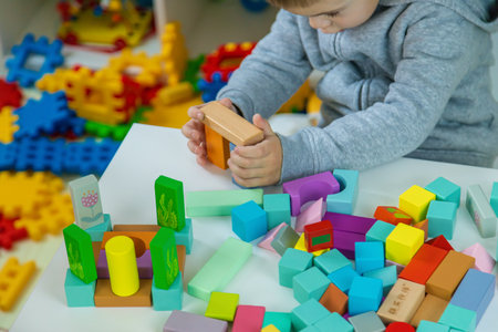 Children playing with toys in the room. Selective focus.の写真素材