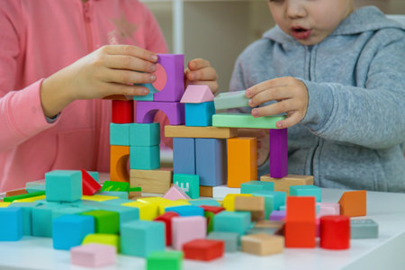 Boy playing with toys in the room. Selective focus.の写真素材