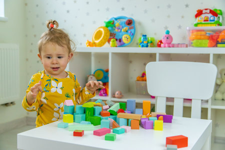 Children playing with toys in the room. Selective focus.の写真素材