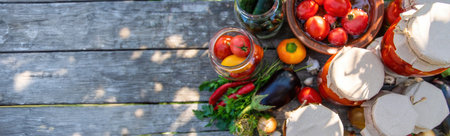 woman canning tomatoes cucumbers vegetables on the background of nature. Selective focus.の写真素材