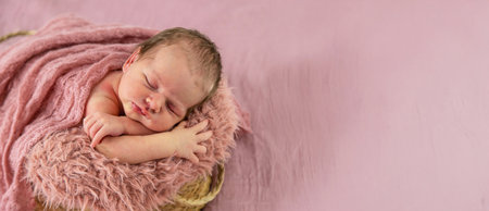 newborn beautiful baby girl sleeping on pink background.baby.の写真素材