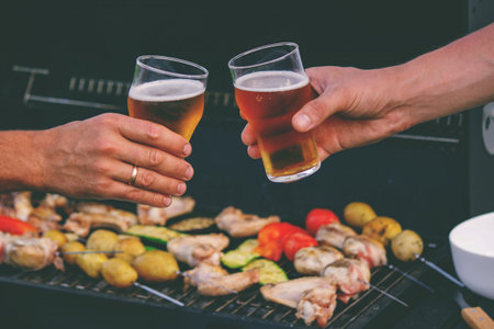 two glasses of beer against the background of a barbecue. recreation. natureの写真素材
