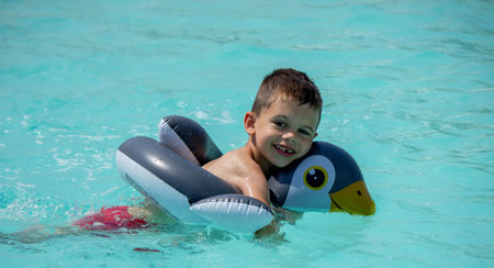 boy in the pool with an inflatable circle. recreation