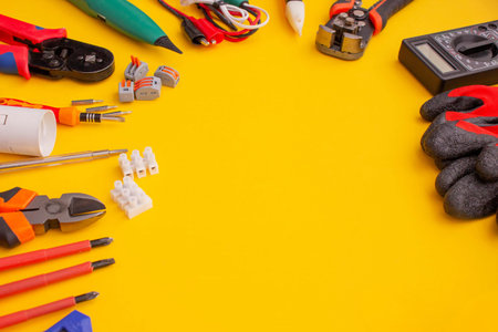 Electrical Tools and Equipment on Yellow Background.の写真素材