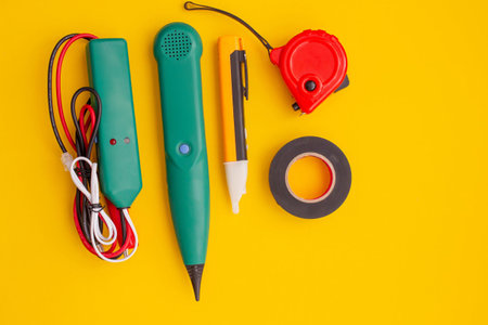 Electrical Tools and Equipment on Yellow Background.の写真素材