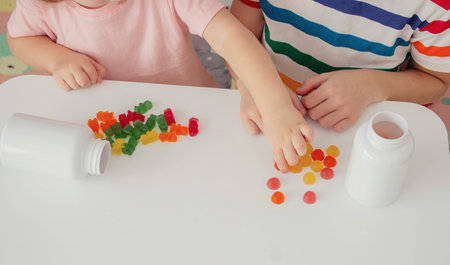 Children eating jelly candies. Deliciousnessの写真素材