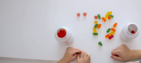 Children eating jelly candies.の写真素材