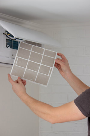 Cleaning Air Conditioner Filter for Better Air Quality.の写真素材
