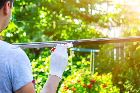 close up of painting metal with brush in gardenの写真素材