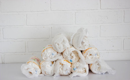 Diaper waste, dirty diapers. Disposal of used baby diapers.