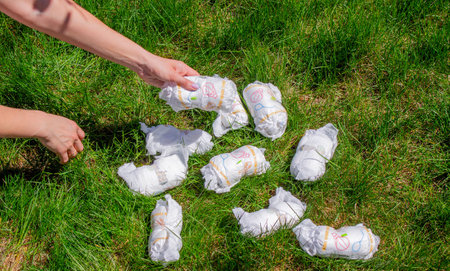 Diaper waste, dirty diapers. Disposal. The impact of disposable diapers on the environment. Environmental pollutionの写真素材